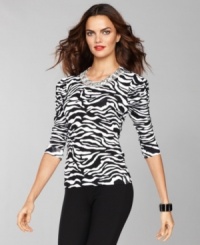 A black and white zebra-inspired print becomes a dramatic statement when INC adds in a high-shine jeweled neckline!