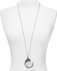 A bold plated silver and gunmetal tone pendant hangs from a simply styled link chain on this Rebecca Minkoff pendant necklace. Wear it as an architectural statement.