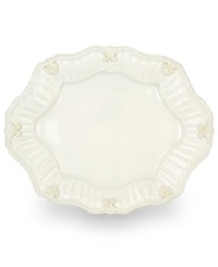 Serve every main course with exquisite taste. Featuring a raised pattern of cascading vines, elegant fluting and a gently scalloped rim, this large oval platter brings distinctly vintage style to the table. Coordinates with Butler's Pantry dinnerware and dishes collection.