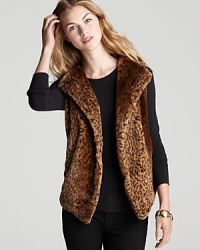 Liven up your cold-weather wardrobe with this plush Aqua animal-print faux fur vest. Wear with workday neutrals or dress up your off-duty denim.