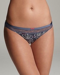 Calvin Klein Underwear's basic bikini is cut in a flattering silhouette with an all-over floral print and lace trim at the waist. Style #F3308.