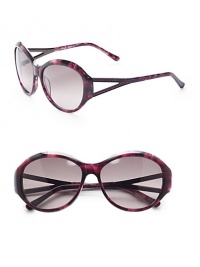 THE LOOKRounded style Variegated acetate framesAustrian crystal temple accentsCutout templesUVA and UVB protection Signature case includedTHE COLORVariegated purple with grey gradient lensesORIGINImported