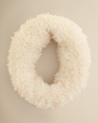 On a sled or little skis, your little snow bunny will float over the slopes in this soft, feathery neck warmer from Echo.