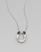 A black sapphire adorned pendant on a delicate chain. Black sapphires Sterling silver Length, about 18 Pendant size, about ¾L X ½ W Imported 