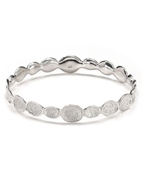 Textured 'pods' shine in silver plated brass in this infinity bangle from Melinda Maria.