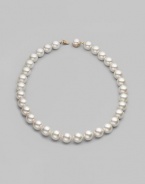 Elegant organic white man-made pearls make a perfect finishing touch. 14mm white round pearls Length, about 20 Mabé pearl and 18k gold vermeil push-lock clasp Made in Spain