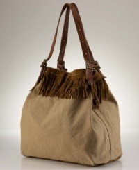 Denim & Supply Ralph Lauren's slouchy, oversized canvas tote gets a couture touch with swingy suede fringe detailing and supple leather accents that owe their inspiration to wilderness roots.