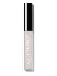 A gorgeous combination of light-catching glitter and non-sticky shine. Part of Bobbi's Caviar & Oyster Collection, this iridescent shade creates a pearly, nude lip: a perfect pairing for dark, intense eyes. The formula is enriched with emollients and Vitamins C and E to moisturize, condition and protect lips, too. Made in Canada. 