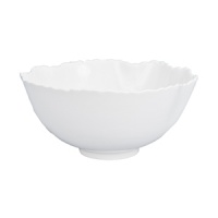 An organically scalloped, off-white dinnerware pattern that contributes elements of both texture and design to your dining experience.