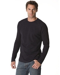 Long sleeved raglan tee with ribbed sleeves and side panels. Crew neck.