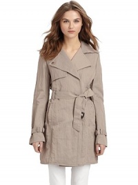 This essential layer exudes workweek chic with its double breasted front and gorgeous rumpled texture.Notched collar converts to point collar Concealed double breasted button-front Single gun flap Long buckled belt ties at front Vertical welt pockets Back rain shield Inverted center back pleat with button closure at hem Cotton lining About 32½ from shoulder to hem 66% nylon/34% cotton; dry clean Imported