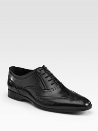 A handsome dress standard is accented with perforated and lace-up details. here.Leather upperLeather liningRubber soleMade in Italy