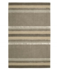 Linear designs are accented with exotic faux silk to create a timeless palette in the Sahara area rug from Calvin Klein. Crafted by skilled artisans in India, it features generously thick wool and viscose fibers woven to create remarkable strength and impeccable elegance.