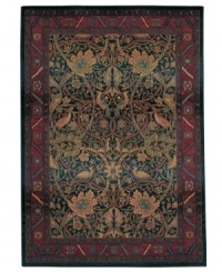 Traditional motifs get a modern overhaul on this sumptuously styled Sphinx area rug. Daring hues paint a chic, swirling pattern complete with vines, blossoms and birds. Made from soft polypropylene for superb durability.