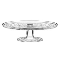 Hundreds of sparkling glass droplets traverse this dimensional piece from Iittala's Kastehelmi collection. To celebrate designer Oika Toikkas 50th, Iittala reintroduces a selection of his most popular pieces-including this pressed glass cake stand-from the original 1964 dewdrop collection.