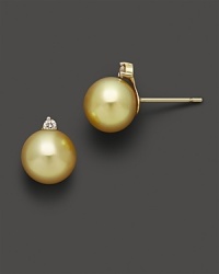 Cultured golden South Sea pearls and diamond stud earrings in 14K yellow gold.