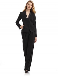 THE LOOKSatin banded collarLightly padded shouldersConcealed front button closureLong sleeves with concealed button cuffsTwo front welt pocketsPrincess seamsBack ventTHE FITAbout 24 from shoulder to hemTHE MATERIALBody: 65% triacetate/35% polyamideTrim: polyesterSilk linedCARE & ORIGINDry cleanMade in USA