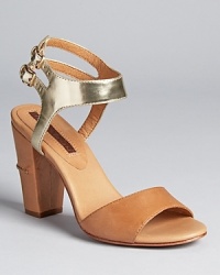 A bi-color design from Modern Vintage, featuring a trend-right block heel with ladylike appeal.