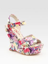 A secure slingback and adjustable ankle strap add comfort to this chic floral-printed patent leather contoured wedge. Self-covered wedge, 4¾ (120mm)Covered platform, 1½ (40mm)Compares to a 3¼ heel (80mm)Patent leather upperLeather liningRubber trek solePadded insoleMade in ItalyOUR FIT MODEL RECOMMENDS ordering one size up as this style runs small. 