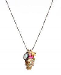 Traditional Mexican folk art gets the glam touch from Betsey Johnson. Crystal-accented skull pendant with heart-shaped eyes accented by pink enamel flower, goldtone heart and clear crystal charms. Crafted in antique gold-plated mixed metal. Approximate length: 16 inches + 3-inch extender. Approximate drop: 3/4 inch. Comes with pink leopard gift box.