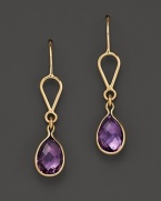 Bezeled amethyst teardrops, framed in 14K yellow gold.