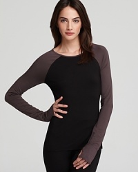 Tried-and-true Calvin Klein comfort meets sporty styling in this lounge top with baseball-tee sleeves and thumbholes.