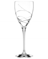 A fanciful cut pattern contrasts the timeless form of this Adorn goblet from the Lenox crystal stemware collection.