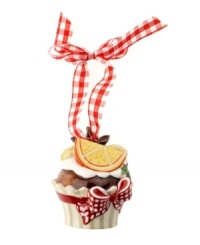 Something to savor around your table and tree, this Winter Bakery cupcake ornament is decorated with snow-white icing, star anise and orange. Hangs from gingham ribbon. From Villeroy & Boch.