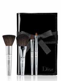 This deluxe travel brush set includes deluxe sizes of Dior's Backstage Powder, Cheek, Eyeshadow and Lip brushes in a foldable patent brush roll. 