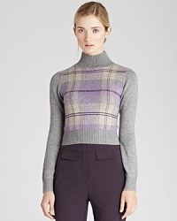 This 90s-inspired cropped REISS sweater features a Tartan plaid pattern and a super-sleek fit. Pair it with high-waist trousers for an authentic British look.