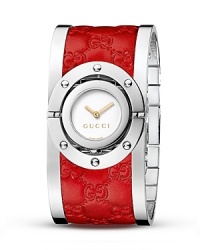 An embossed leather strap in bold red makes a statement on this Gucci bangle watch.