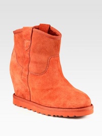 Practical and fashion-forward suede boot, lined with shearling and heightened by a hidden wedge. Suede-covered heel, 3½ (90mm)Rubber platform, ¾ (20mm)Compares to a 2¾ heel (70mm)Shaft, 7Leg circumference, 11Suede upper with grosgrain trimPull-on styleShearling liningRubber solePadded insoleImported