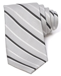 Diagonal stripes dash across a textured silk tie from The Men's Store at Bloomingdale's.