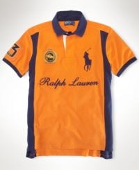 A custom-fitting rugby shirt celebrating the St. Moritz Polo World Cup on Snow receives a preppy feel with a scripted Ralph Lauren logo, bold color-blocking and Ralph Lauren's embroidered Big Pony.