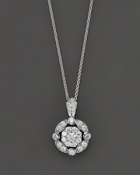 An elegant diamond pendant necklace in white gold with a vintage feel.