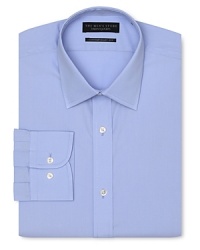 Dress shirt with spread collar, two button barrel cuffs and a contemporary fit through the body, with a solid blue hue.