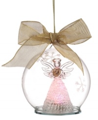 Bringing three times the cheer to your tree, this unique Lenox angel serves as ornament, light and figurine in sheer, snowflake-printed glass. Tied with gold ribbon.