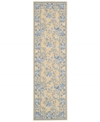 Attractive floral images make this country-style rug a delightful addition to any room. Woven from plush wool, the Country Heritage rug features a muted yellow field, speckled with beautiful blues and whites.