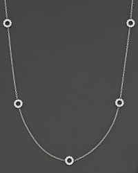 A delicate white gold chain with 5 double-sided white gold diamond circle stations.