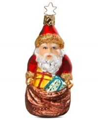 Santa Claus is coming to town! Adorn your Christmas tree with this festive Inge-Glas ornament featuring Santa and his bag of goodies. Mouth-blown and hand-painted.