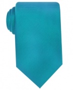 A subtle pattern on this Geoffrey Beene silk tie provides just the right amount of pop in the office.