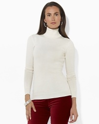 The ultimate in understated elegance, a chic turtleneck is crafted from soft combed cotton and accented with Ralph Lauren's iconic monogram.