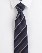 Simple stripes, thick and thin, on elegant Italian silk.SilkDry cleanMade in Italy