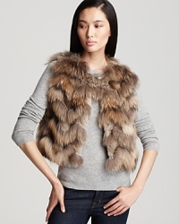 Indulge yourself in the ultra-luxe warmth of this chic fur Theory vest.