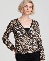 Reveal your animal instincts and trendsetting flair in this silky PJK Patterson J. Kincaid blouse, enriched with a bold cheetah print and leather-trimmed accents.