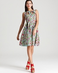 Opt for ladylike sophistication with a lighthearted edge in this Nanette Lepore dress, flaunting a poppy floral print and charming bows.