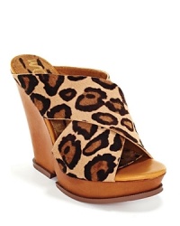 Bold, crisscrossing leopard print straps are a striking new neutral. Pair these platforms with wide-leg denim for a chic '70s flashback. By Sam Edelman.