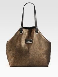 This ultra-soft and luxurious metallic shearling style is accented with leather details.Double leather shoulder straps, 9½ dropCenter snap button strap closure14W X 14H X 5½DImported