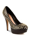 Covered in spiky, gold-tone studs, VINCE CAMUTO's punky Madelyn platforms get to the point in pebbled leather.