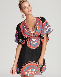 For the best in sand and swim, flaunt your style in this glamorous Trina Turk coverup tunic. A graphic print enlivens while a cinched empire waist flatters.